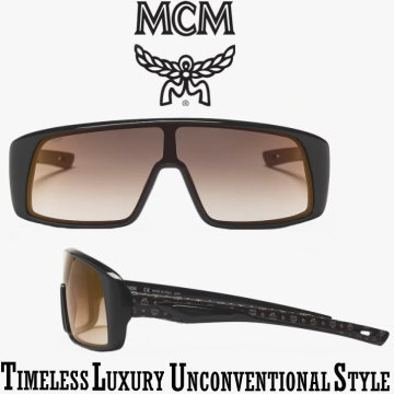 MCM Collection 717SL Mask Unisex Sunglasses � Available in Black/Black